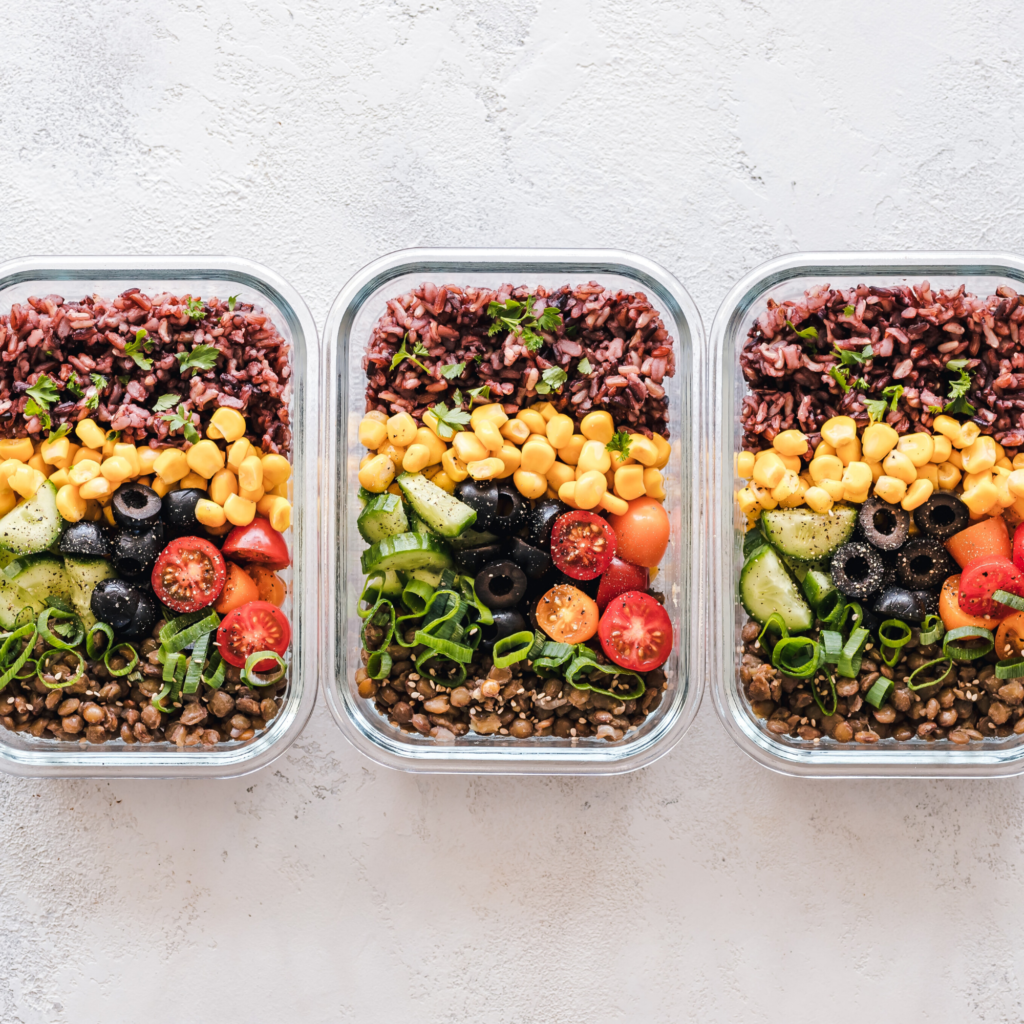 4 Steps to Start Meal Prepping. Prepared meals in glass containers.