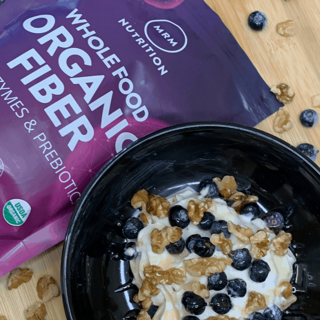 How to Add More Fiber to Your Diet - Greek yogurt combined with 1 scoop of MRM's Whole Food Organic Fiber, a handful of frozen blueberries, walnuts and a drizzle of honey